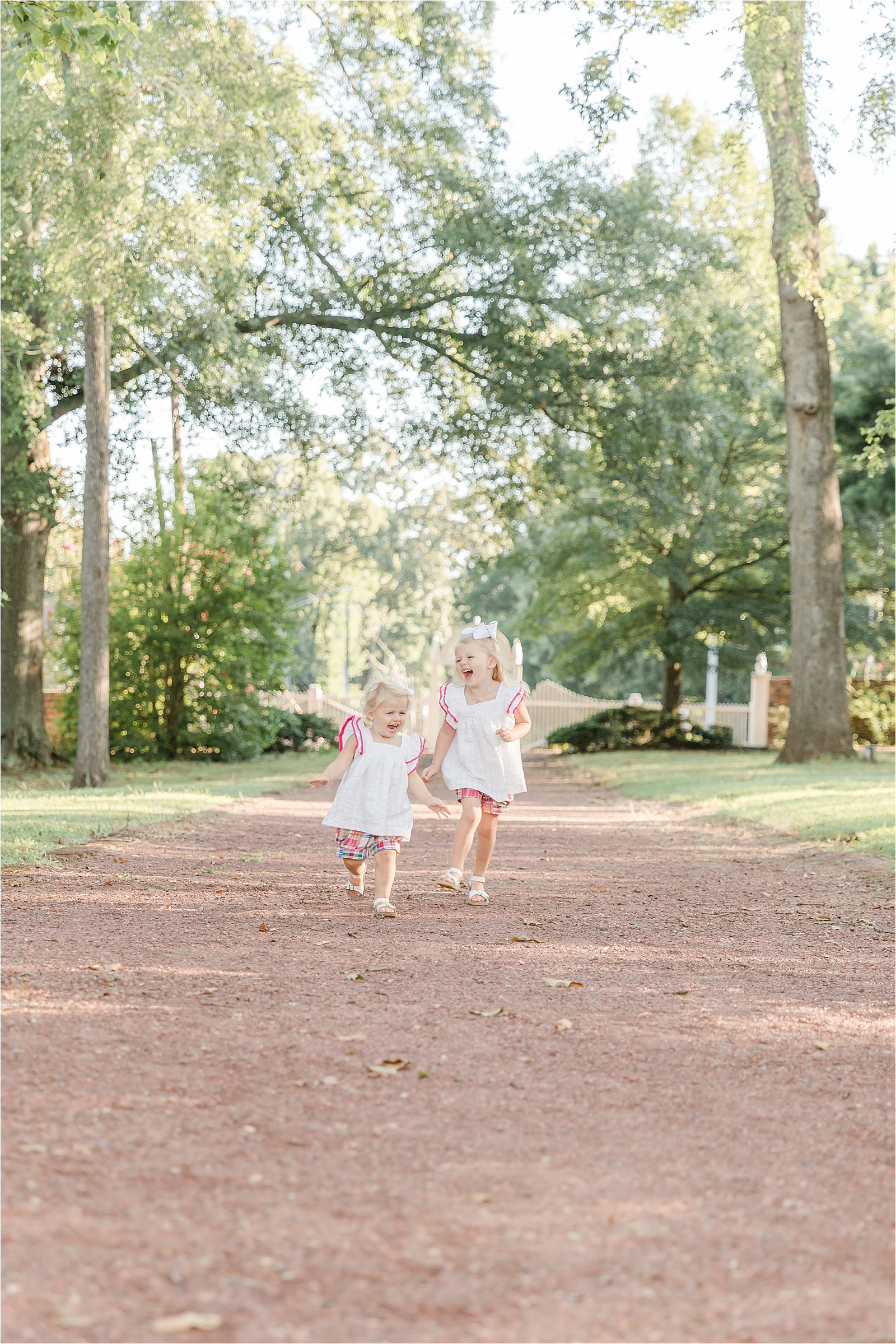 Young sisters running up the driveway at Barrington Hall