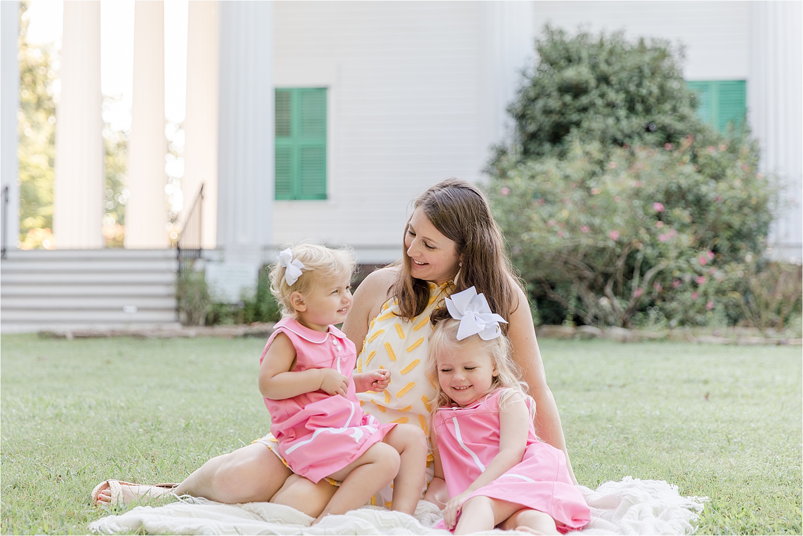 Mom and two young daughters in pink Beaufort Bonnet dresses