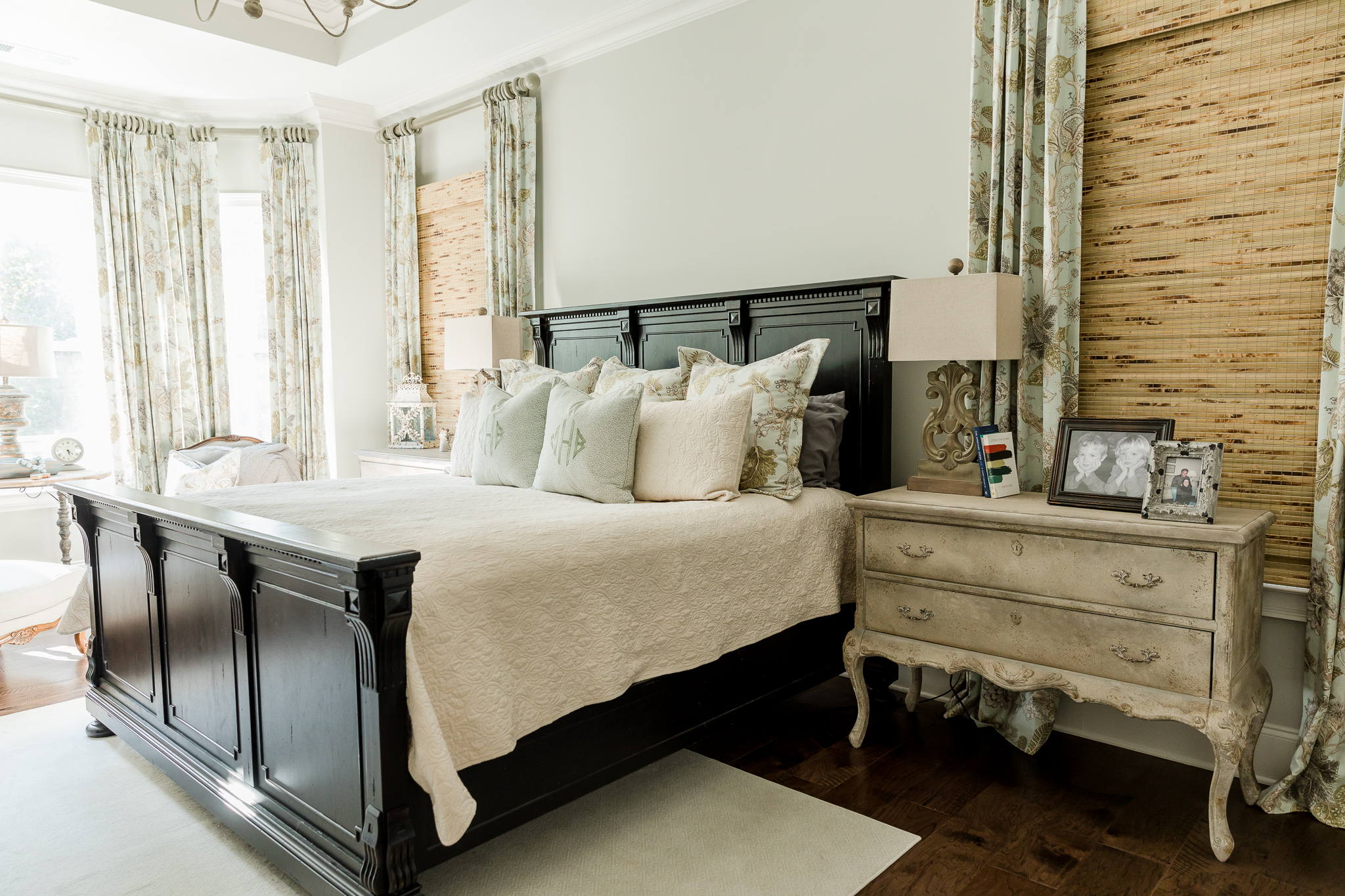 traditional master bedroom with king size bed and antique dresser