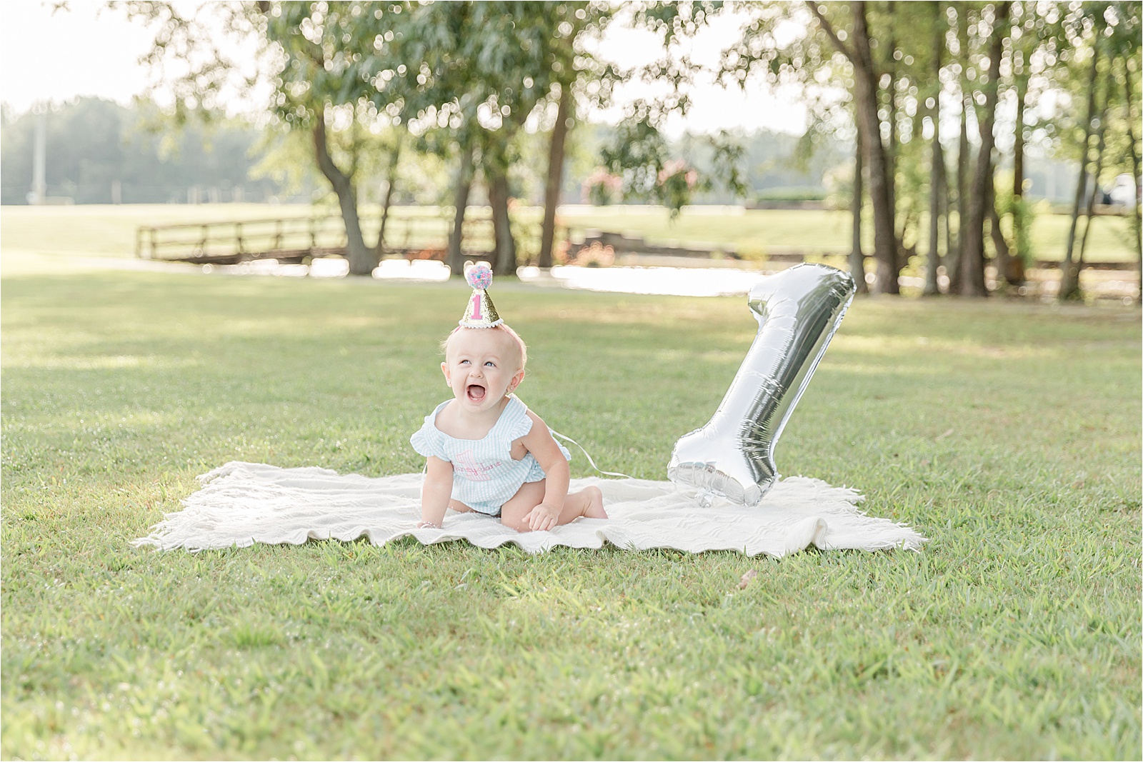 Baby girl with 1 balloon by photographer in Greenville SC