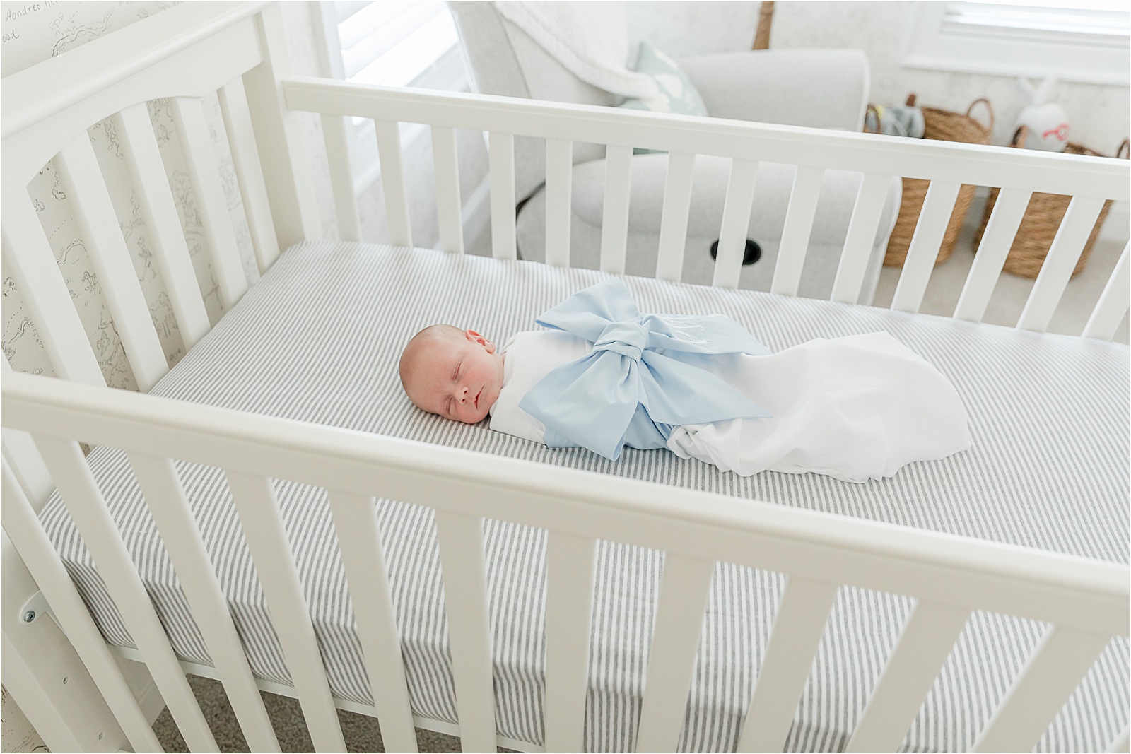 sleeping newborn in crib
