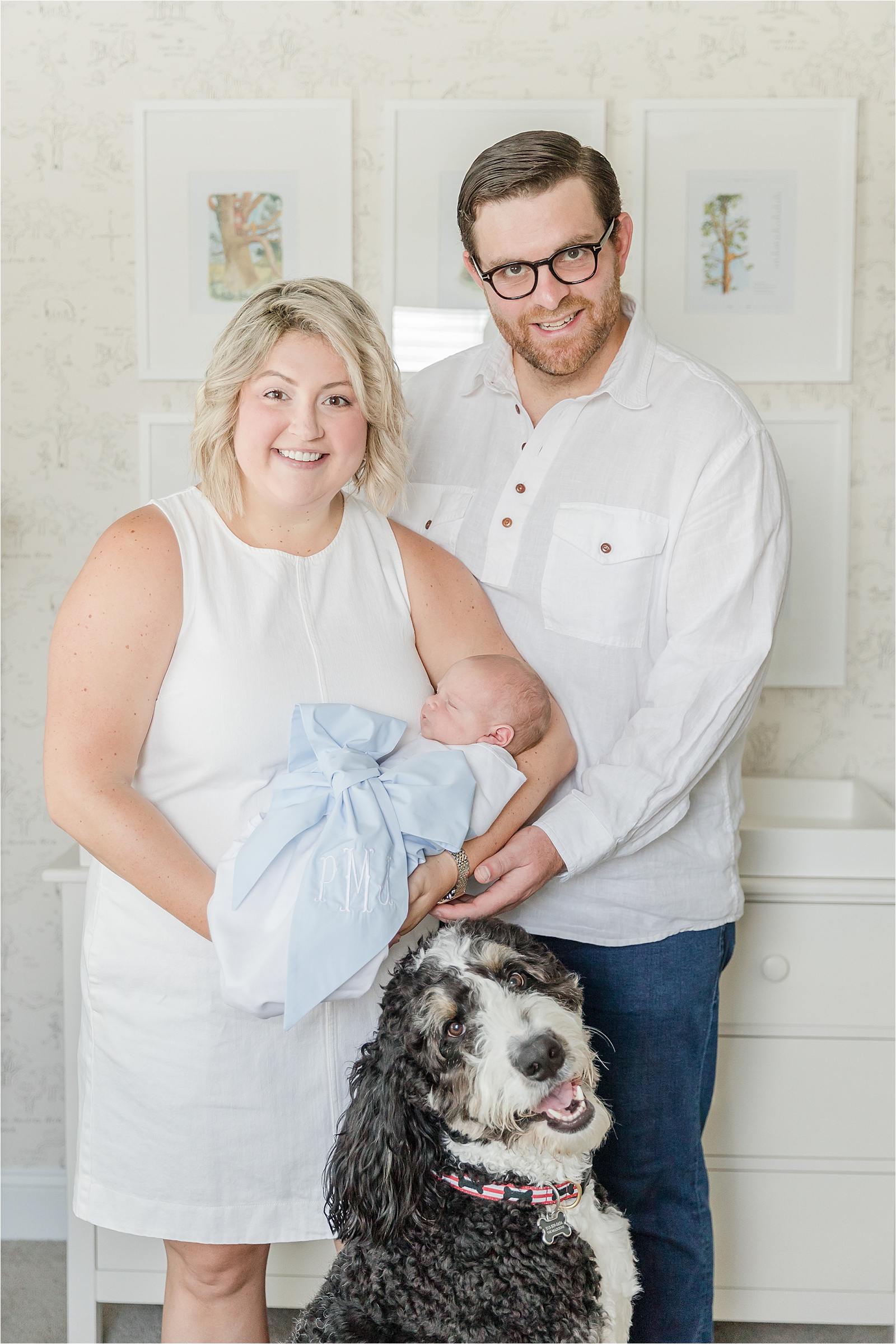 Family photo with baby and dog in vintage Winnie the Pooh Nursery