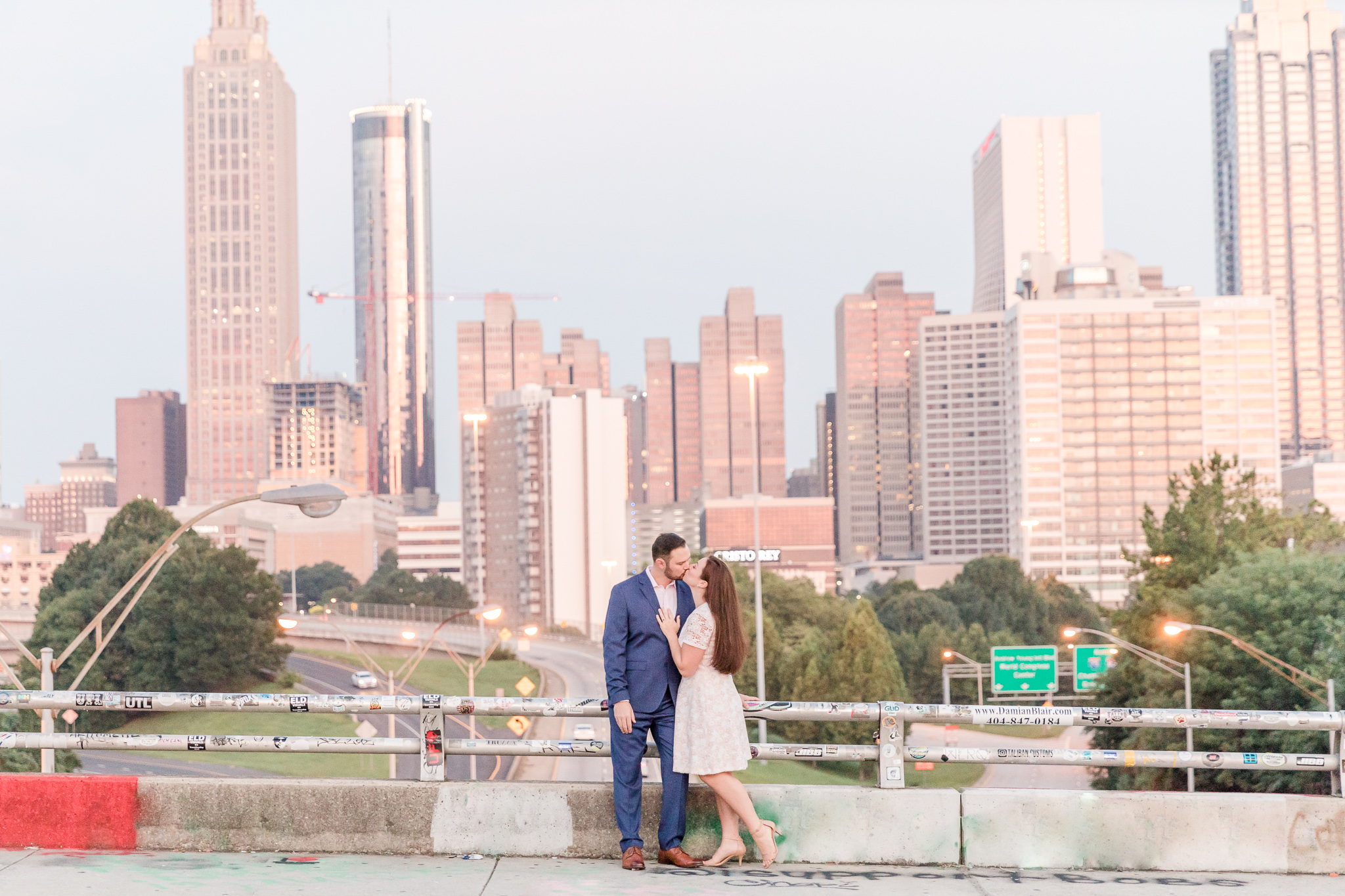 couple kissing on Jackson Street Bridge