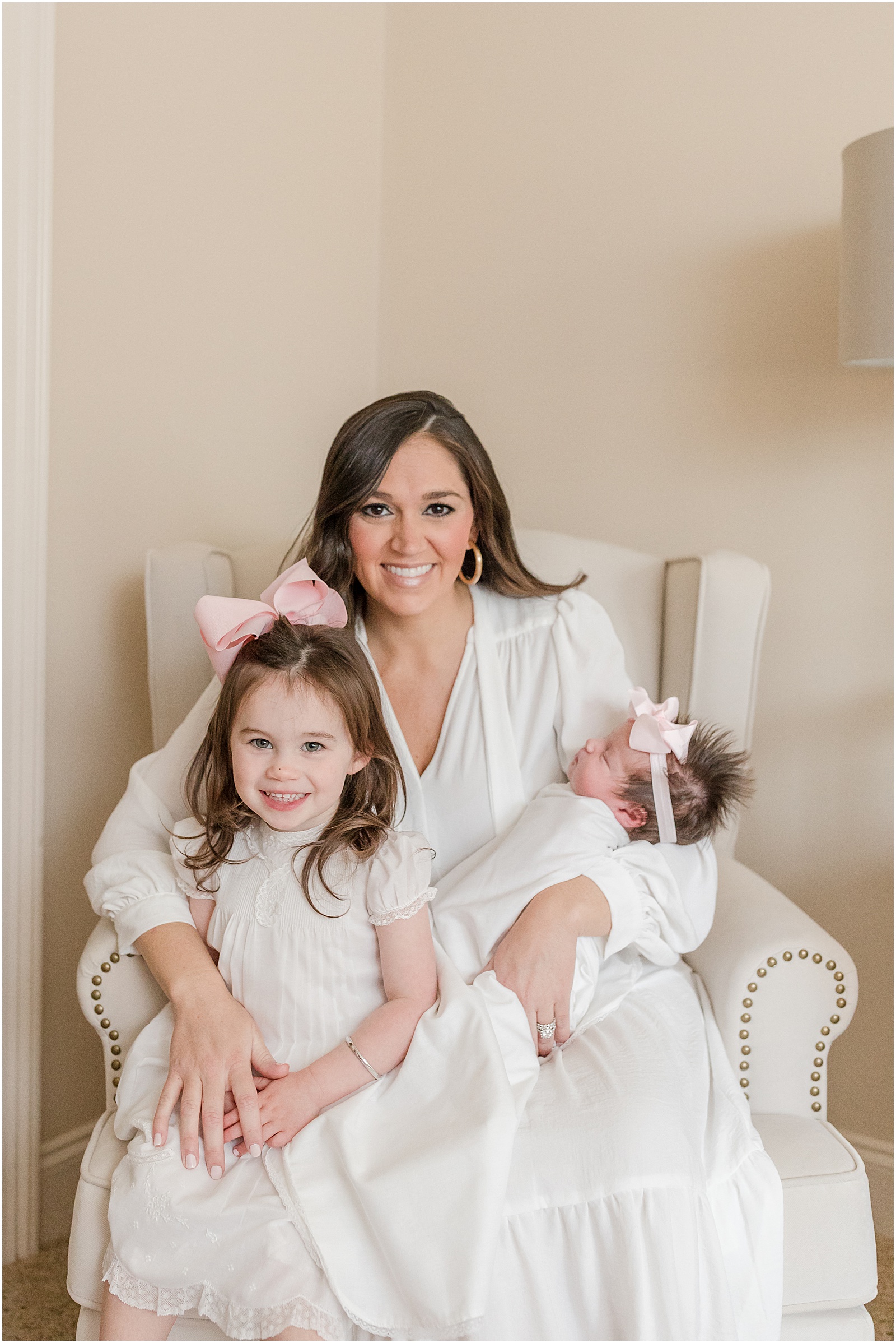 Newborn portraits of a mother with her two daughters in their home by Greenville photographer Molly Hensley