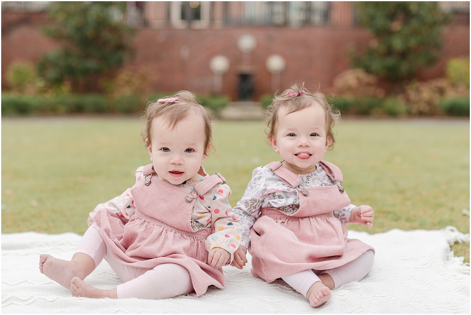 Twin babies photographed on a white blanket in Alpharetta Georgia