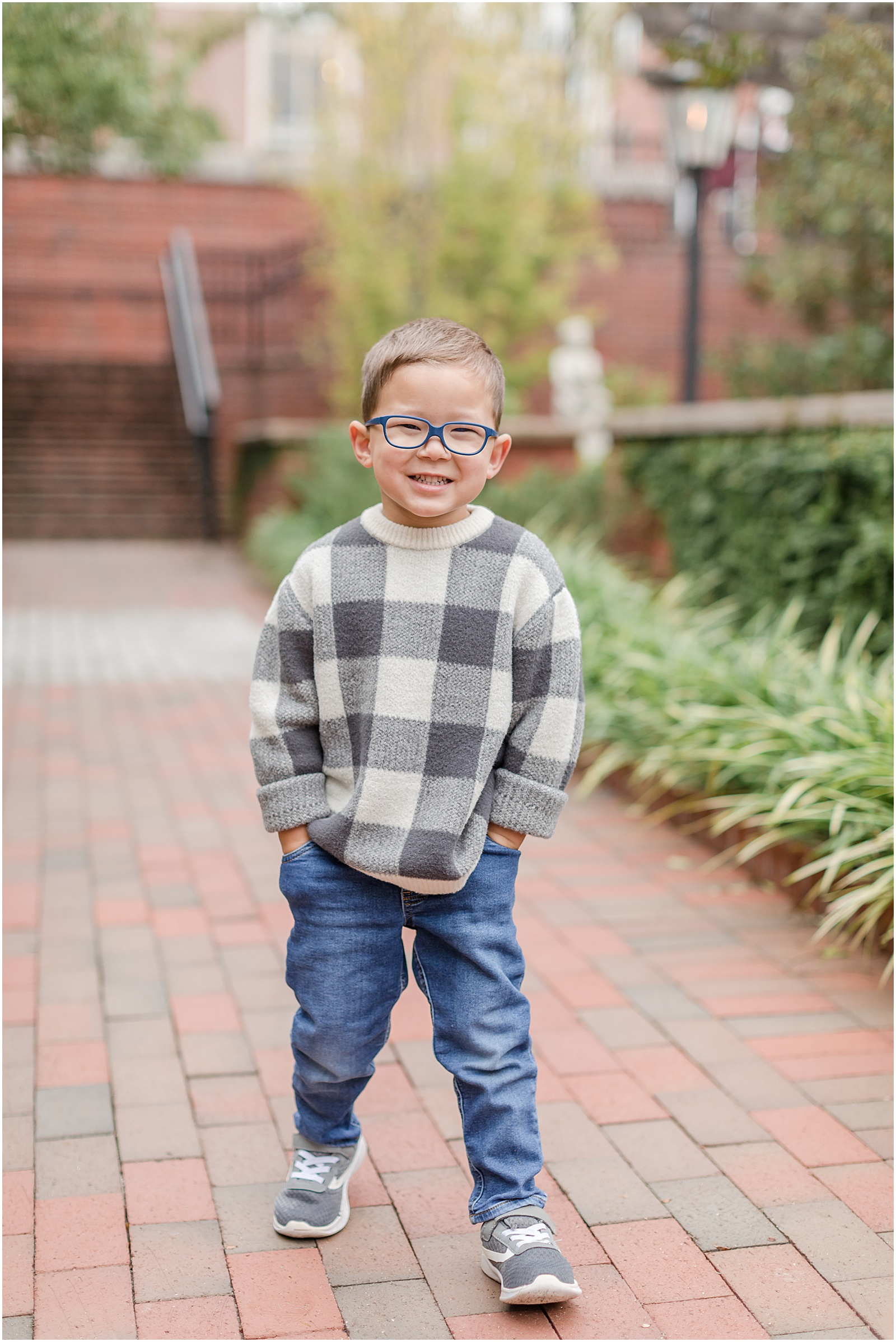 Young boy photographed on brick pathway in Alpharetta Georgia