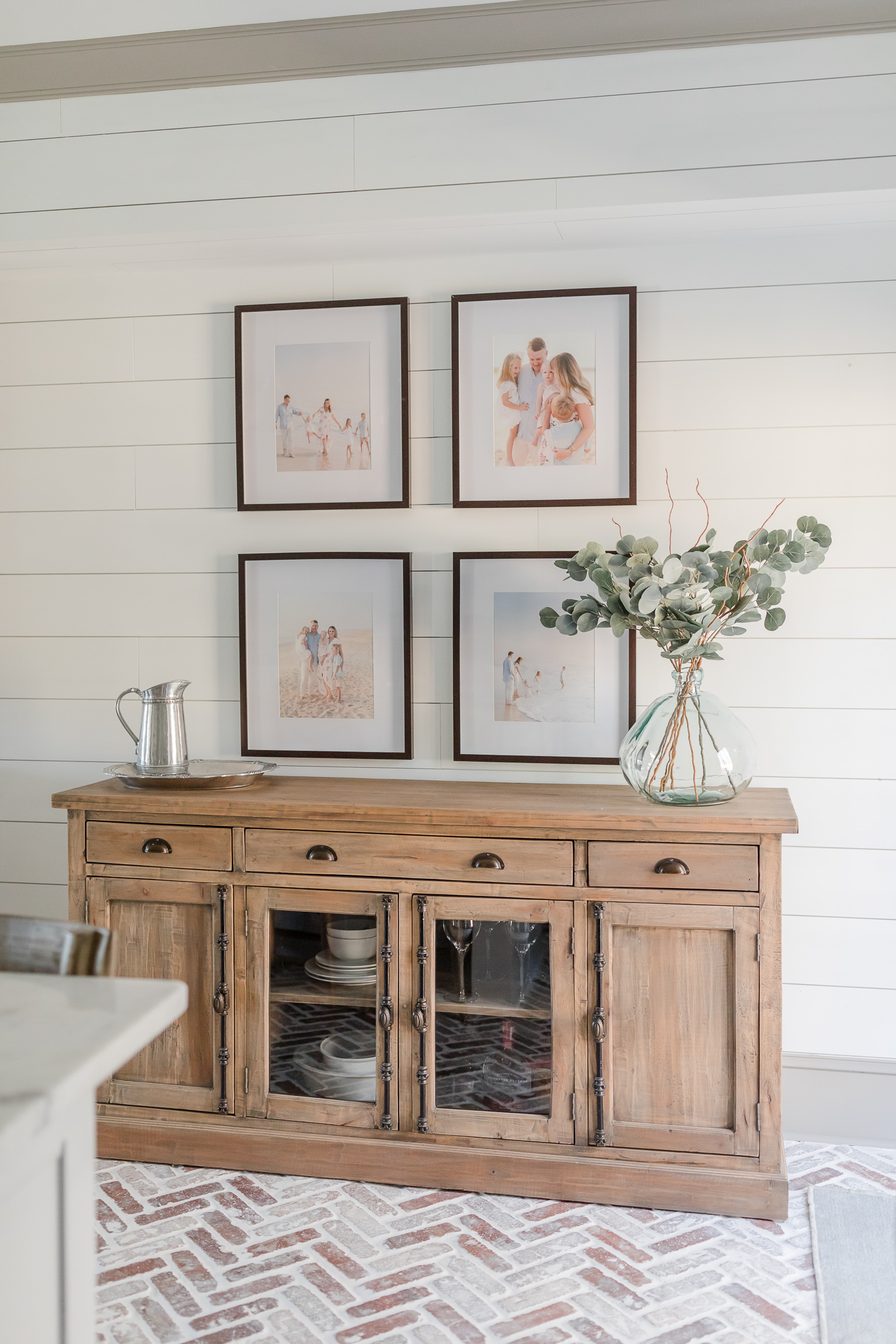 Family photos in picture frames hanging on walls