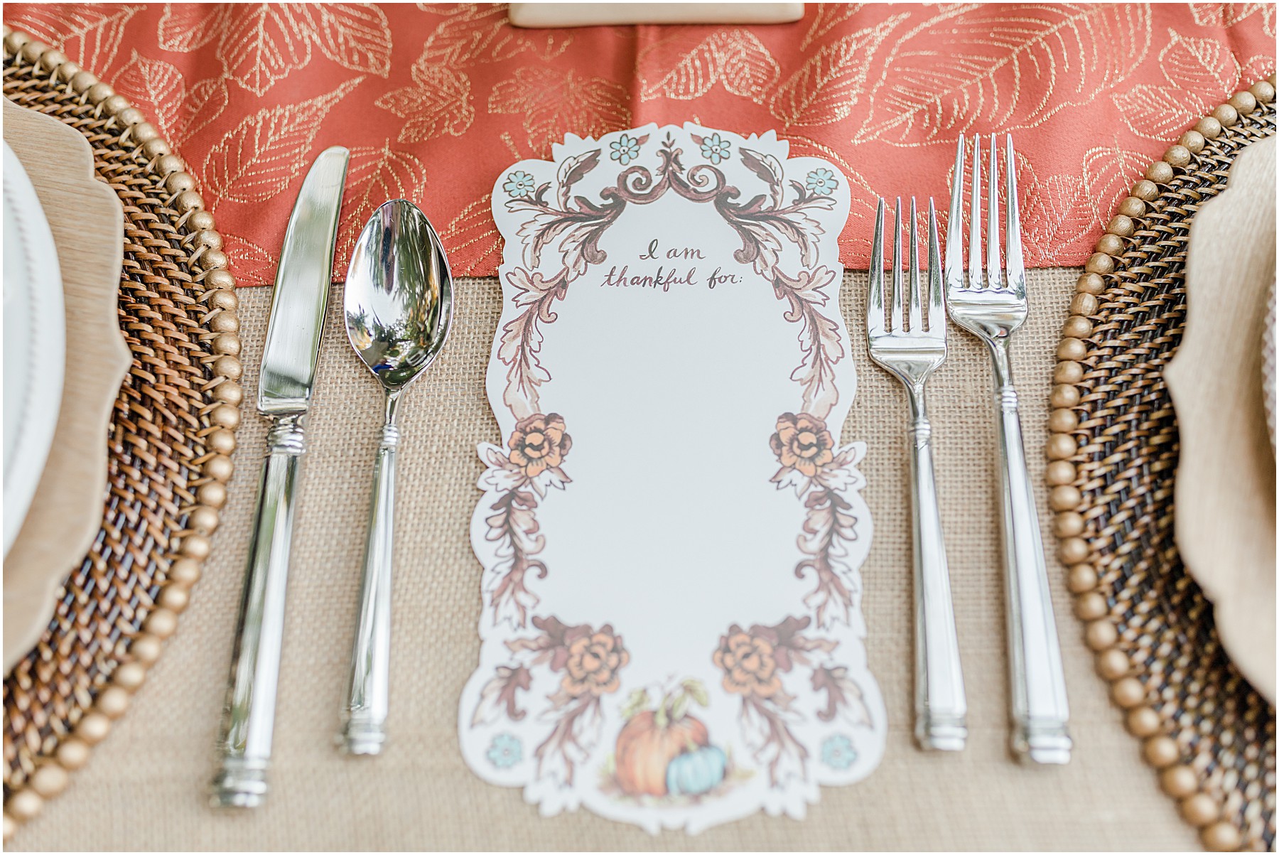 A Thanksgiving table decor featuring a paper to write what you are thankful for.