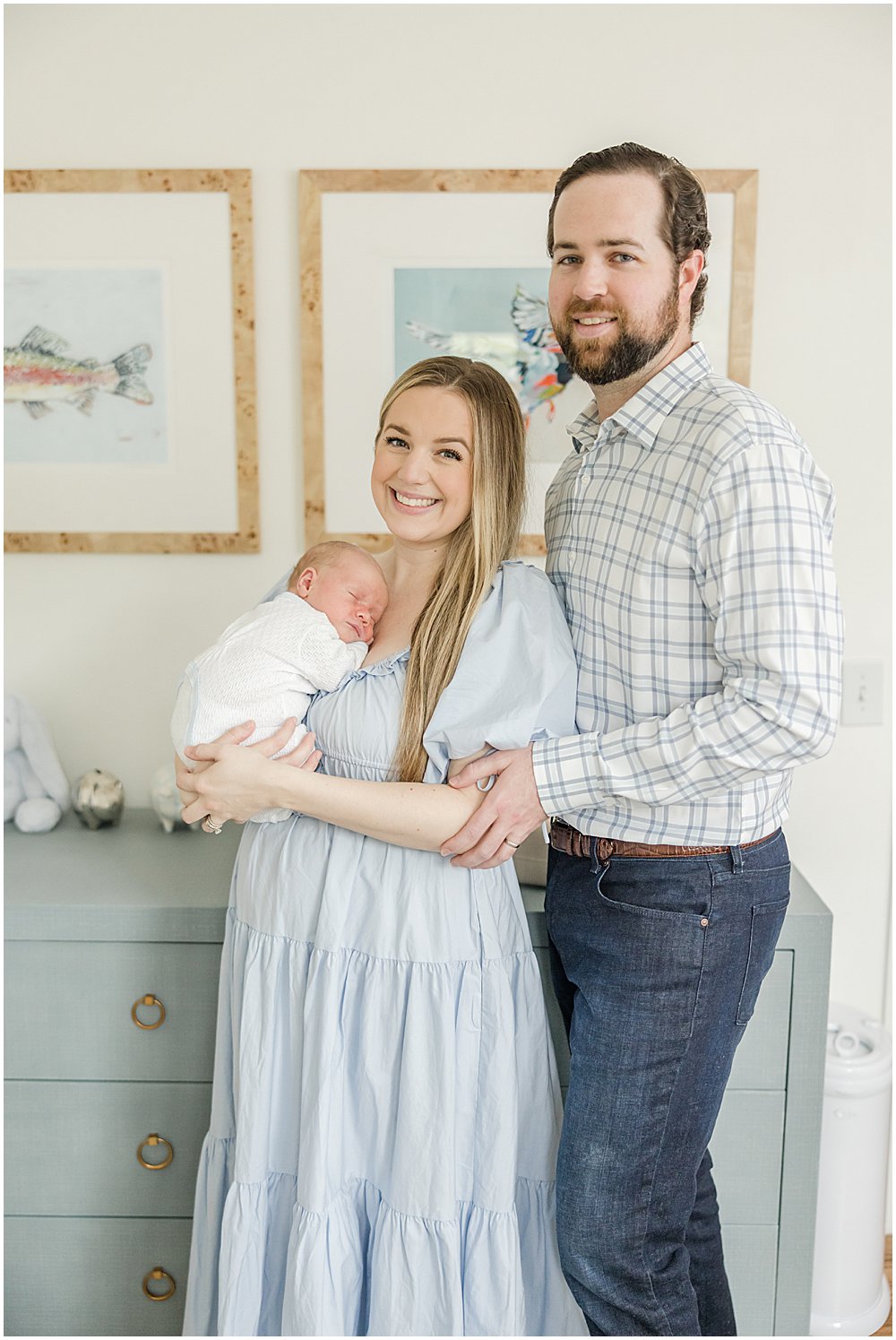 Portraits of a newborn boy and his parents at their home.