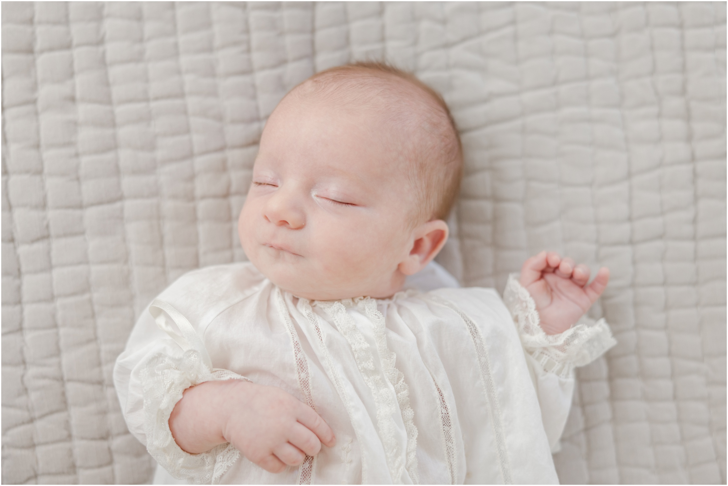 Portrait of an newborn baby boy in an heirloom lace gown for his Greenville newborn portrait.