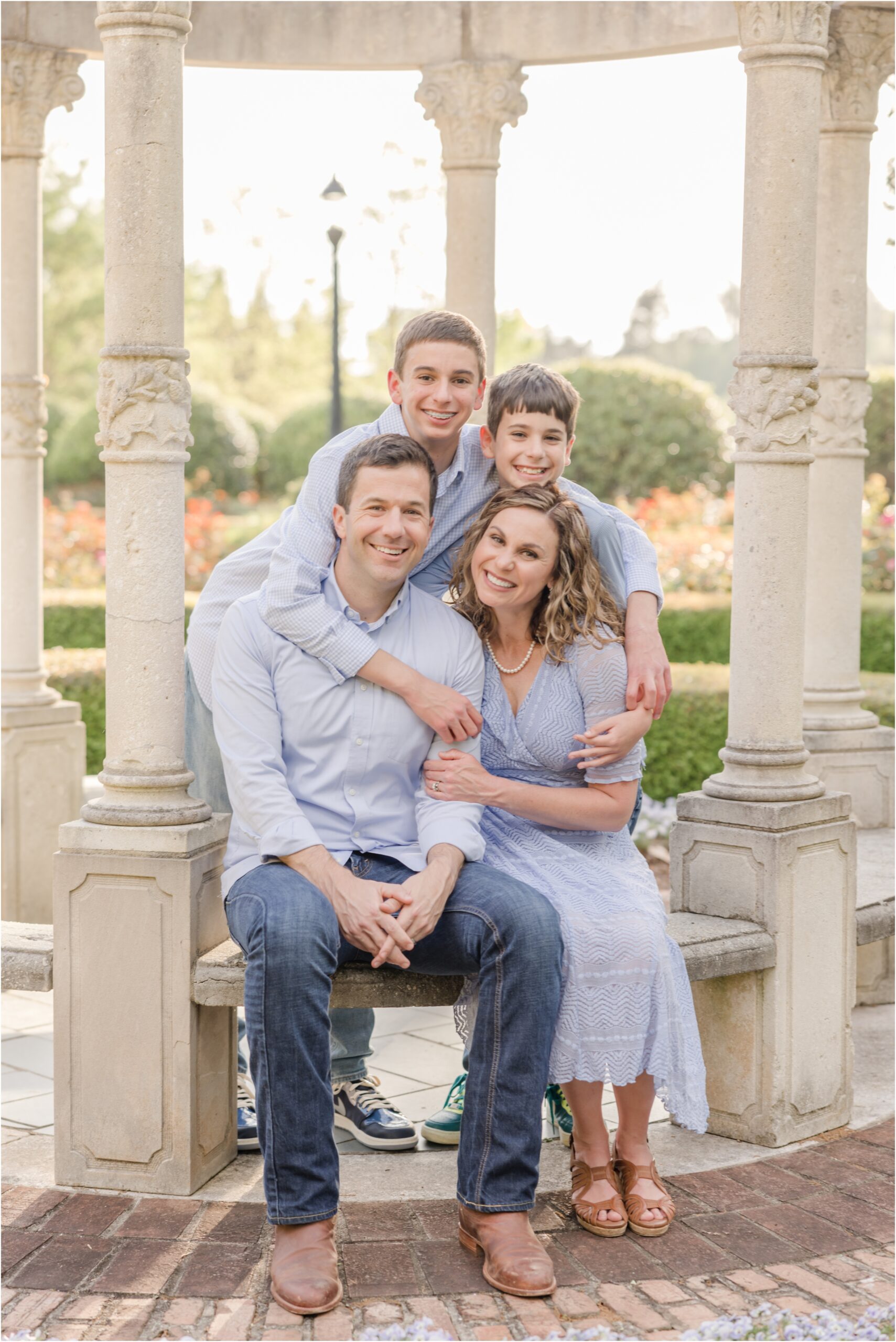 Portrait of a family in the rose garden on Furman's campus in Greenville SC.