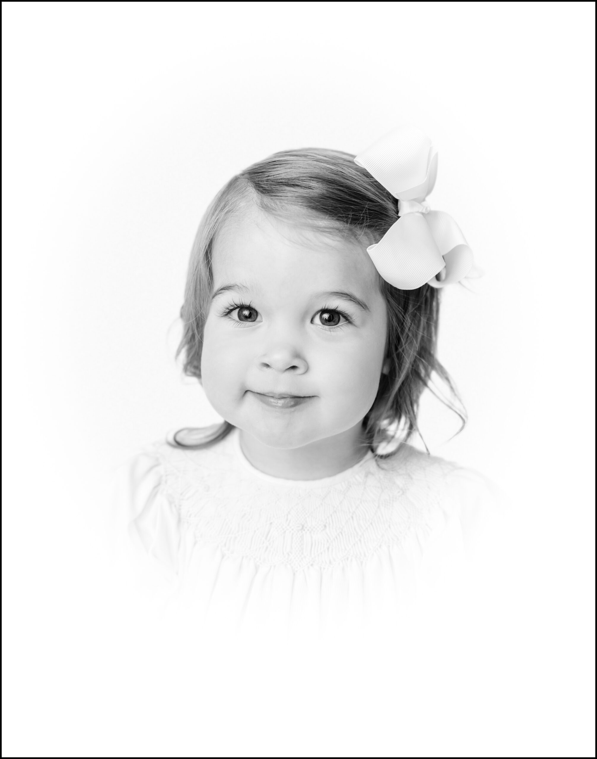 Heirloom portrait of a two year old girl with white vignette by Greenville photographer Molly Hensley