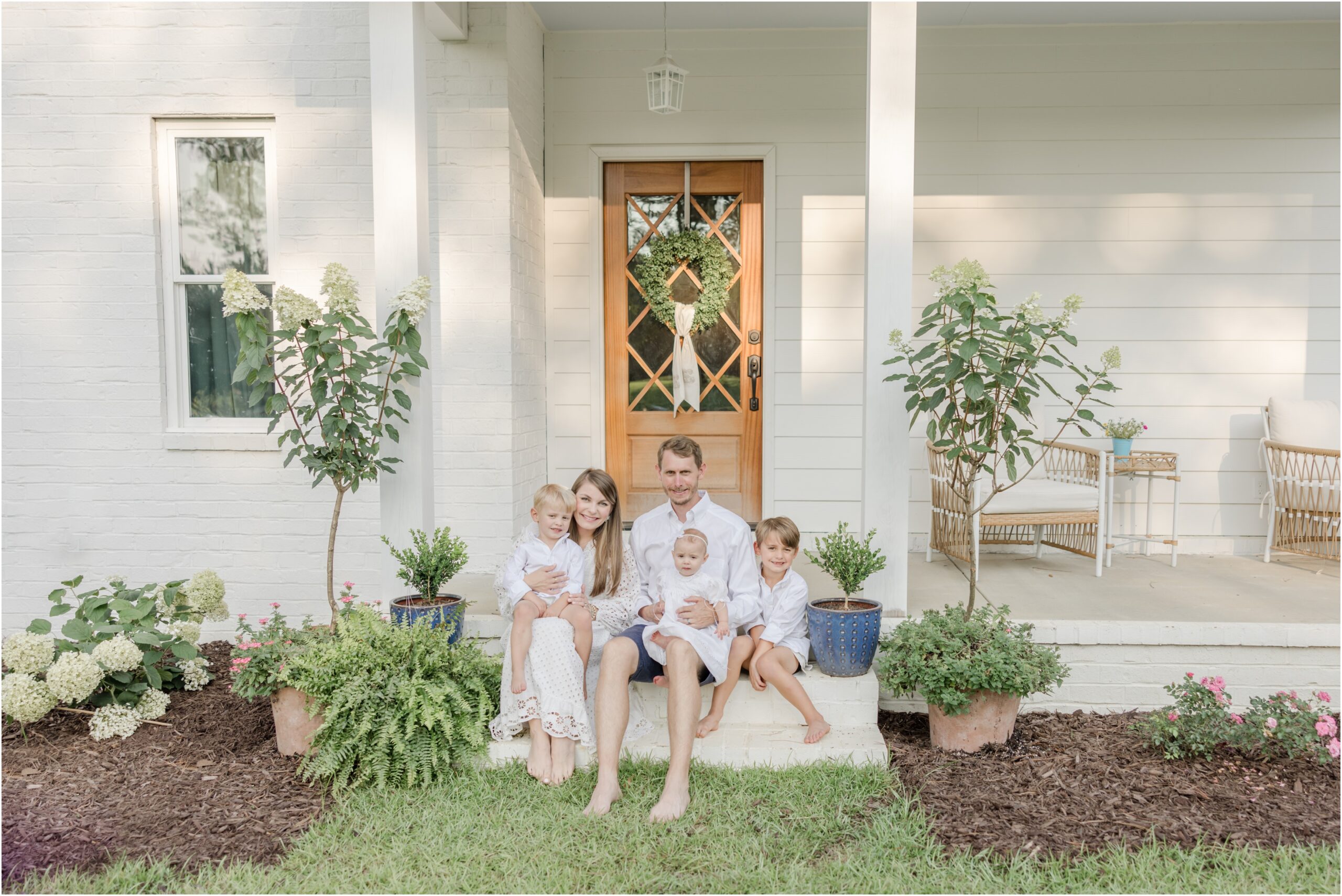Greenville Family Portraits taken on front porch of white cottage