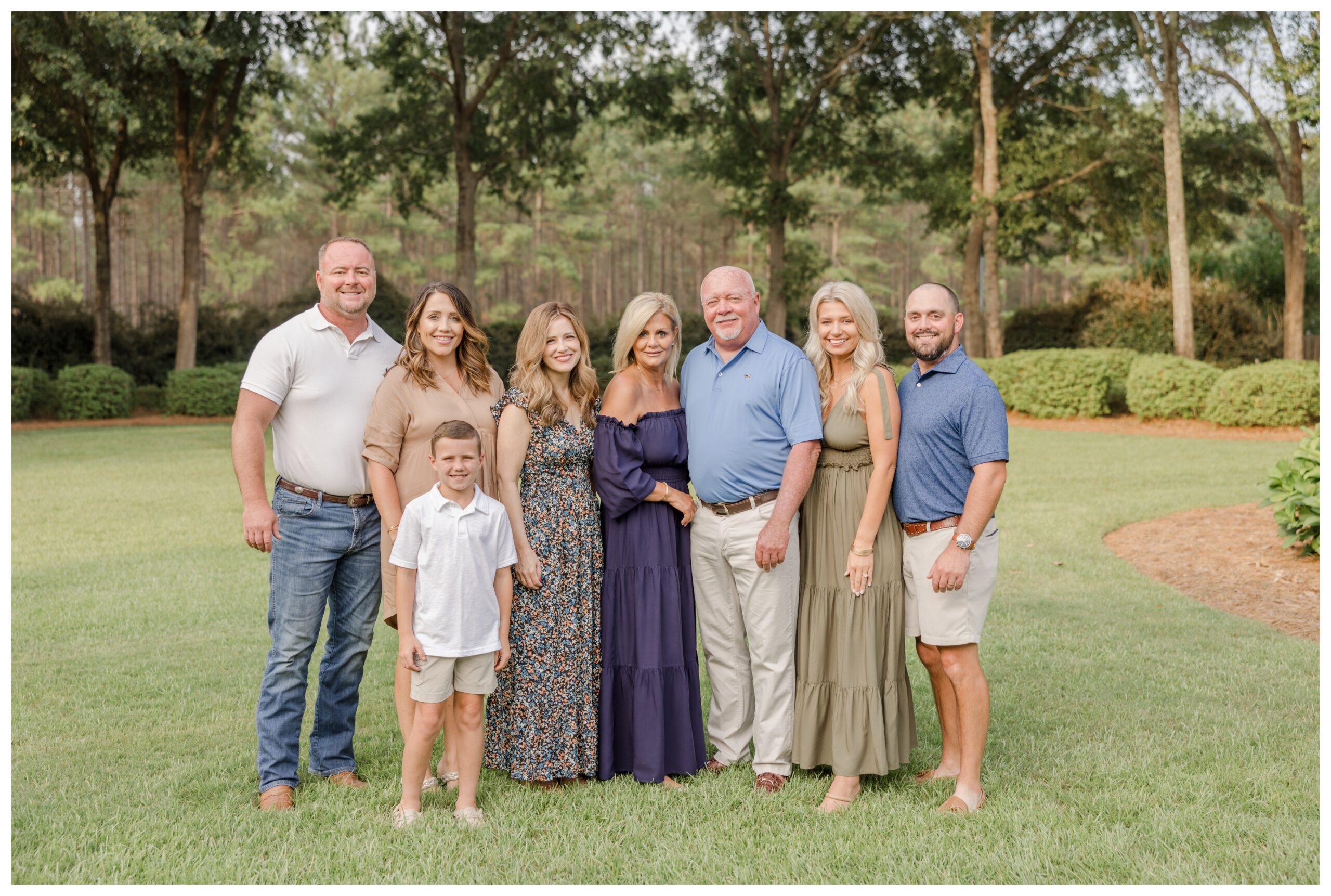 Family portrait of grandparents with their children and grandchild from a Greenville family photography session.
