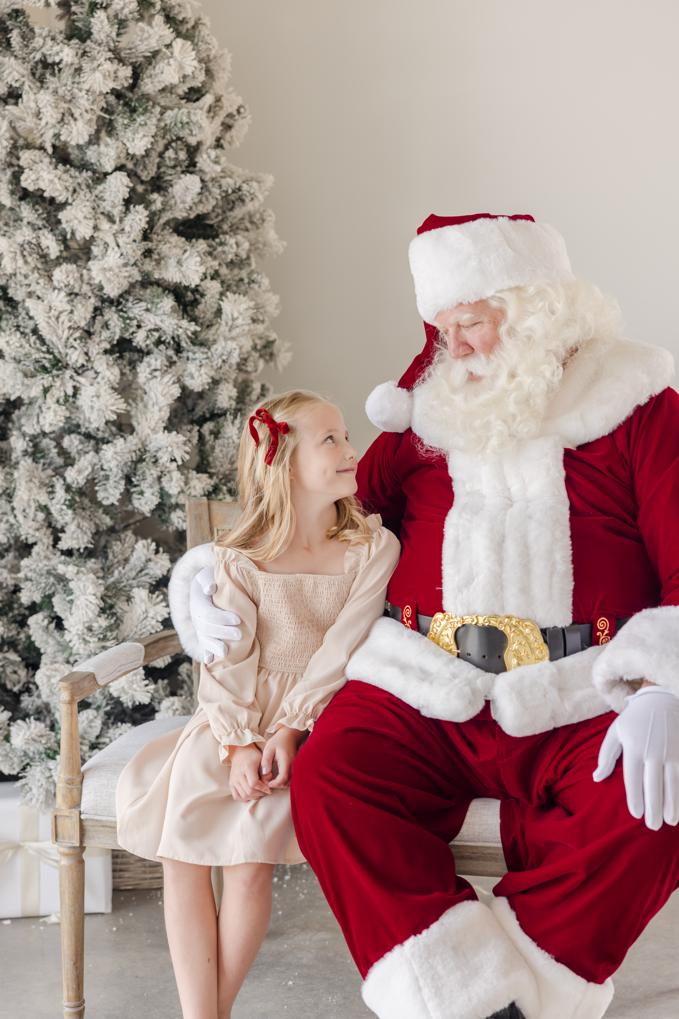 Portrait of a young girl gazing up at Santa taken by a Greenville area family photographer.